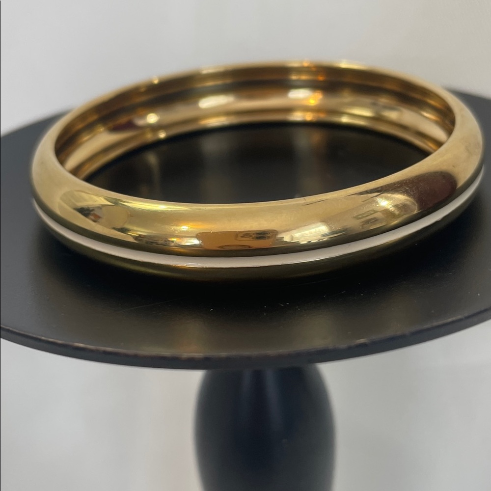 MONET Gold Tone Bangle Bracelet With Cream Enamel Stripe Around it. Size 8